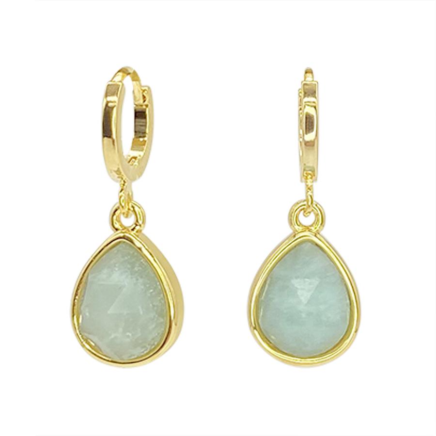 A pair of gold hoop earrings with handmade teardrop-shaped pendants. The pendants feature translucent, light blue Amazonite Drops gemstones set in gold bezels. The earrings dangle elegantly, showcasing the natural stones' slightly rough texture. Introducing the Amazonite Drop Earrings by Aria V.