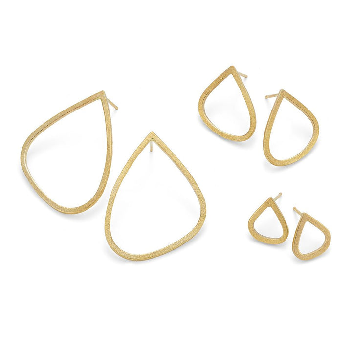 The image shows three pairs of Gold Wing Stud Earrings by Leoma Drew in various teardrop shapes and sizes. The largest pair on the left has open, elongated drops, the medium pair in the middle has smaller, open drops, and the smallest pair on the right features dainty open drops.