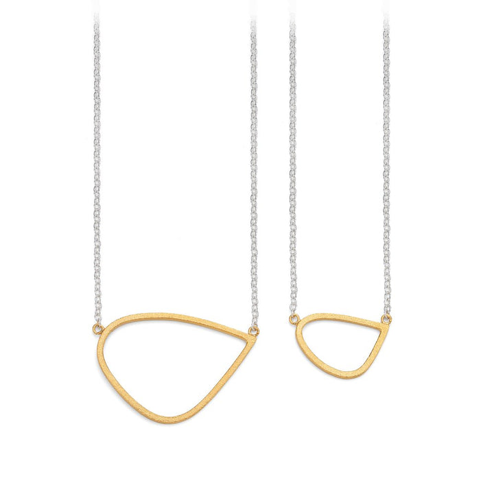 Two Leoma Drew Gold Wing Pendant with Silver Chain necklaces with gold vermeil, irregularly shaped open teardrop pendants. One necklace has a larger teardrop shape, while the other has a smaller teardrop shape. Both pendants feature a minimalist design.